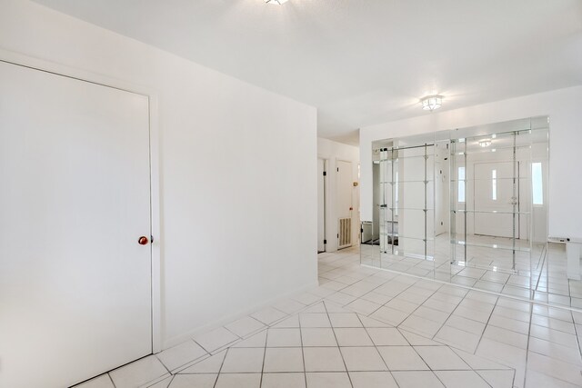 3920 Blackberry Ln, Port Arthur, TX 77642 - spare room featuring light tile patterned flooring and baseboards