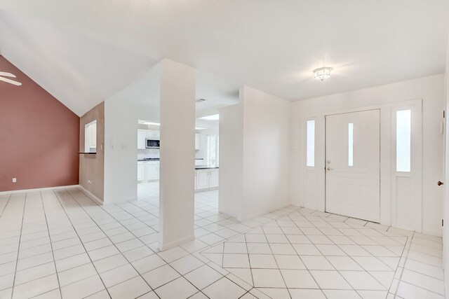 3920 Blackberry Ln, Port Arthur, TX 77642 - entryway featuring light tile patterned floors, baseboards, and vaulted ceiling
