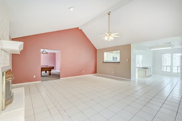 3920 Blackberry Ln, Port Arthur, TX 77642 - unfurnished living room with beamed ceiling, ceiling fan, light tile patterned floors, billiards table, and baseboards