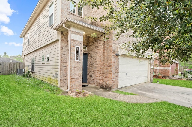 2827 Arica Ln, Spring, TX 77373 - view of property exterior featuring central AC, concrete driveway, brick siding, and an attached garage