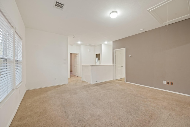 2827 Arica Ln, Spring, TX 77373 - spare room featuring attic access, light carpet, and baseboards