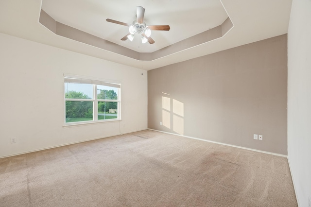 2827 Arica Ln, Spring, TX 77373 - carpeted empty room with ceiling fan, a raised ceiling, and baseboards