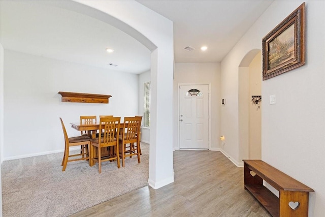 1685 Rd 5102, Cleveland, TX 77327 - dining area with arched walkways, wood finished floors, baseboards, and recessed lighting
