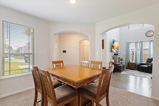 1685 Rd 5102, Cleveland, TX 77327 - dining room with arched walkways, light carpet, and baseboards