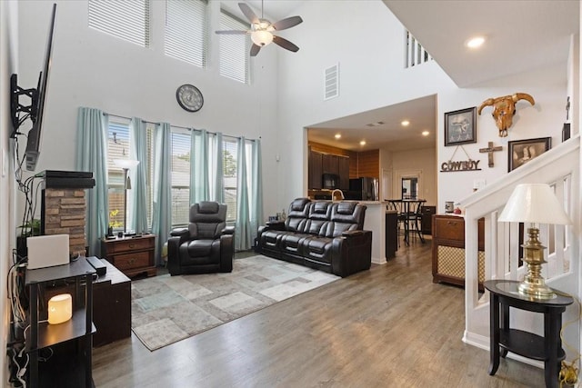 1685 Rd 5102, Cleveland, TX 77327 - living area featuring a ceiling fan, light wood finished floors, a high ceiling, and recessed lighting