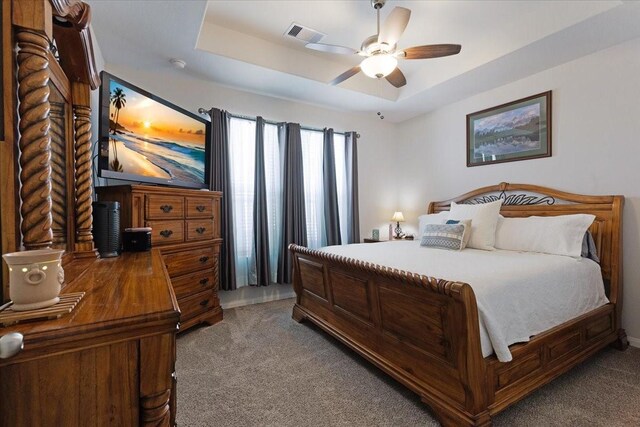 1685 Rd 5102, Cleveland, TX 77327 - bedroom featuring carpet floors, a raised ceiling, and a ceiling fan