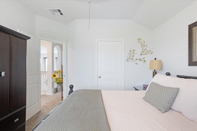 1685 Rd 5102, Cleveland, TX 77327 - bedroom with carpet floors, arched walkways, and vaulted ceiling