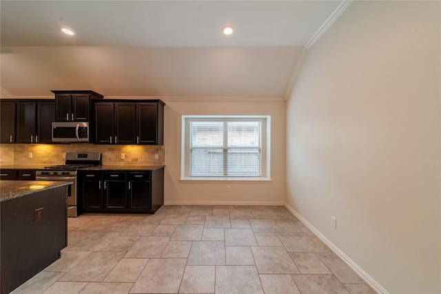 18423 Weeping Spring Dr, Cypress, TX 77429 - kitchen with stainless steel appliances, ornamental molding, tasteful backsplash, dark stone countertops, and baseboards