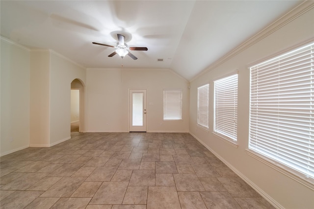 18423 Weeping Spring Dr, Cypress, TX 77429 - spare room featuring arched walkways, ceiling fan, ornamental molding, vaulted ceiling, and baseboards