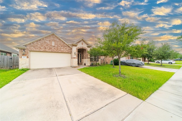 18423 Weeping Spring Dr, Cypress, TX 77429 - french country home featuring concrete driveway, brick siding, a garage, and stone siding