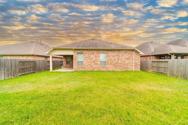 18423 Weeping Spring Dr, Cypress, TX 77429 - rear view of house with brick siding, a patio area, and a shingled roof