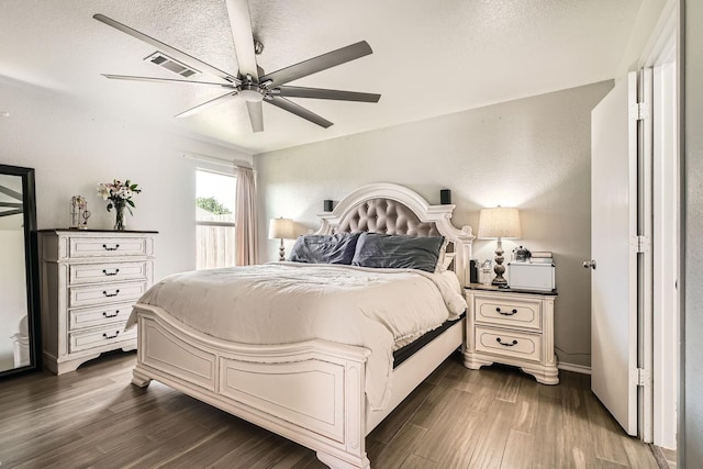 503 Savory Ln, Crosby, TX 77532 - bedroom with dark wood finished floors and a ceiling fan