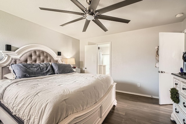 503 Savory Ln, Crosby, TX 77532 - bedroom featuring dark wood finished floors, baseboards, a ceiling fan, and connected bathroom