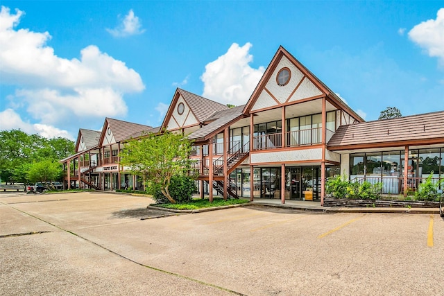 804 W Dallas St Unit 5, Conroe, TX 77301 - view of property with stairway and uncovered parking