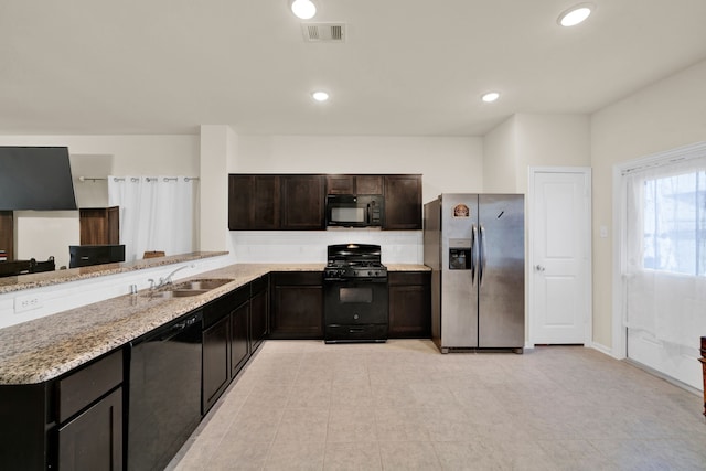 10510 Watershed Dr, Rosharon, TX 77583 - kitchen featuring black appliances, a sink, decorative backsplash, light stone countertops, and recessed lighting