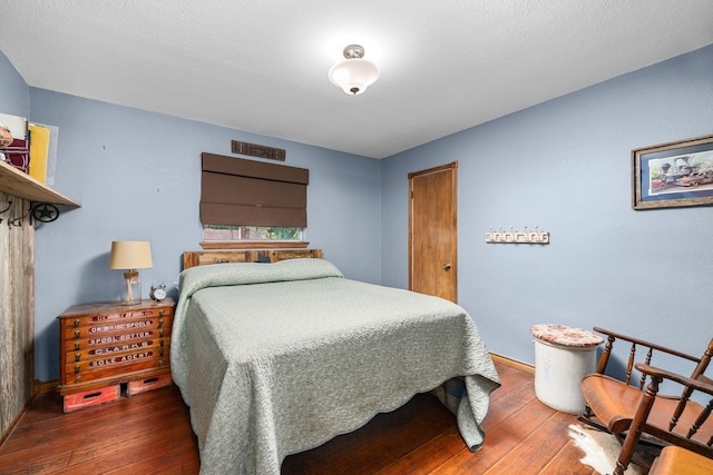 14907 River Oaks Dr, East Bernard, TX 77435 - bedroom featuring hardwood / wood-style floors and baseboards