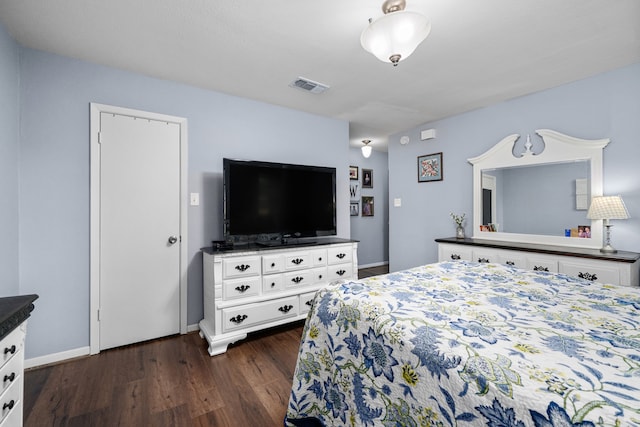 14907 River Oaks Dr, East Bernard, TX 77435 - bedroom with dark wood-style floors and baseboards