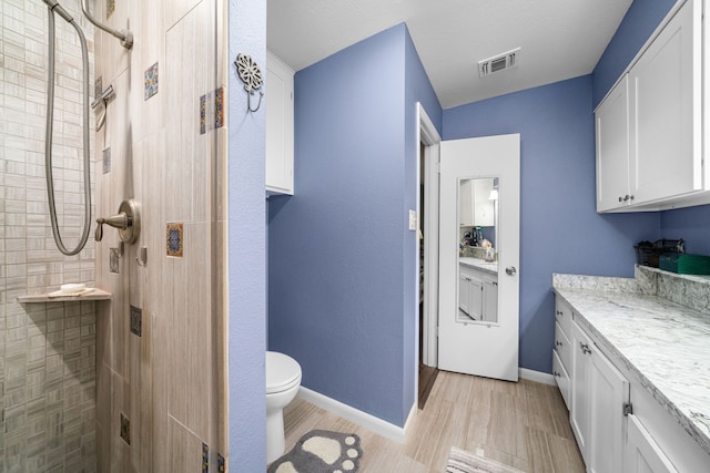 14907 River Oaks Dr, East Bernard, TX 77435 - full bath featuring vanity, a tile shower, and toilet