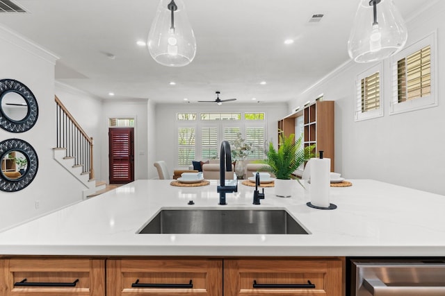 26 Riva Row, The Woodlands, TX 77380 - kitchen with a sink, open floor plan, ceiling fan, ornamental molding, and stainless steel dishwasher