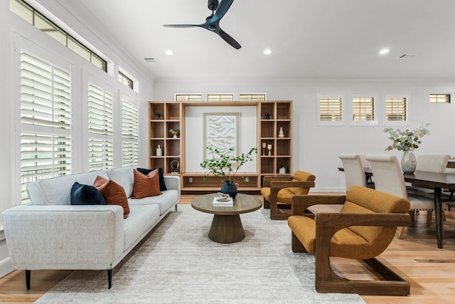 26 Riva Row, The Woodlands, TX 77380 - living area with ornamental molding, wood finished floors, ceiling fan, recessed lighting, and baseboards