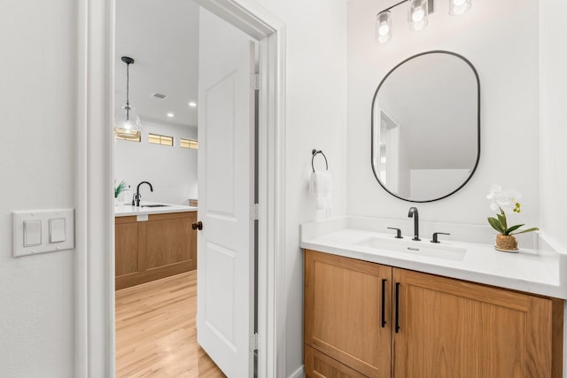 26 Riva Row, The Woodlands, TX 77380 - bathroom featuring vanity and wood finished floors