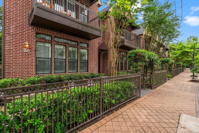26 Riva Row, The Woodlands, TX 77380 - property entrance featuring brick siding and a balcony