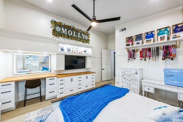 209 Horse Shoe Trl, Angleton, TX 77515 - bedroom featuring light wood finished floors and ornamental molding