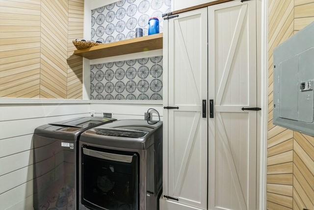 209 Horse Shoe Trl, Angleton, TX 77515 - laundry room featuring separate washer and dryer and electric panel