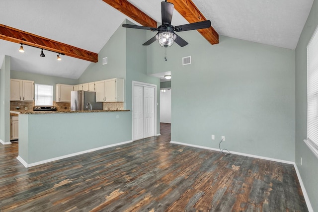 286 Ling St, Bayou Vista, TX 77563 - kitchen with ceiling fan, freestanding refrigerator, baseboards, dark wood-type flooring, and beamed ceiling