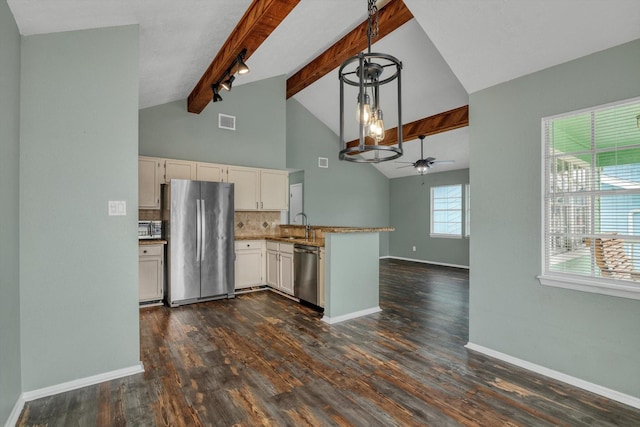 286 Ling St, Bayou Vista, TX 77563 - kitchen with stainless steel appliances, a peninsula, beam ceiling, tasteful backsplash, and dark wood-style flooring