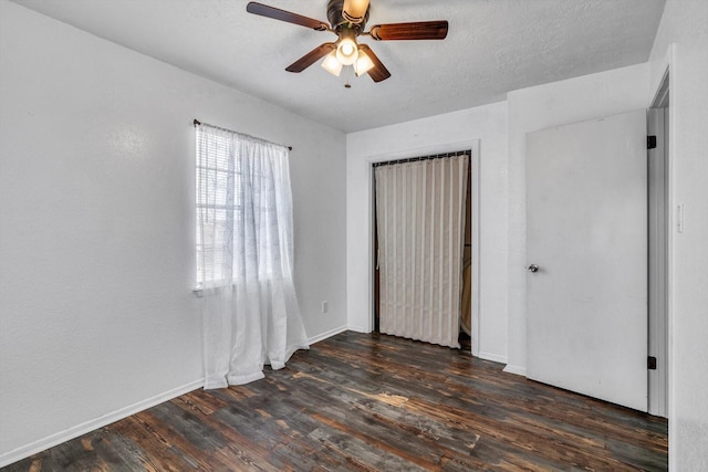 286 Ling St, Bayou Vista, TX 77563 - unfurnished bedroom with wood finished floors, baseboards, ceiling fan, and a closet