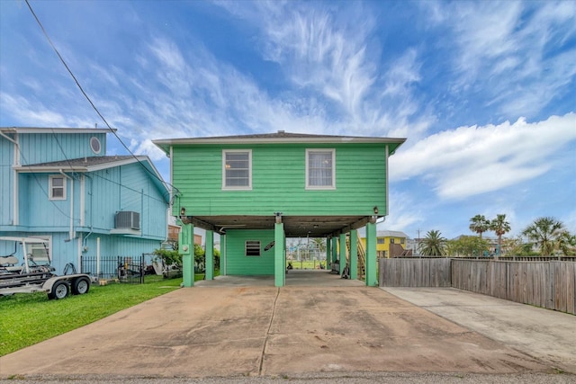 286 Ling St, Bayou Vista, TX 77563 - view of front of property featuring a carport, driveway, and cooling unit