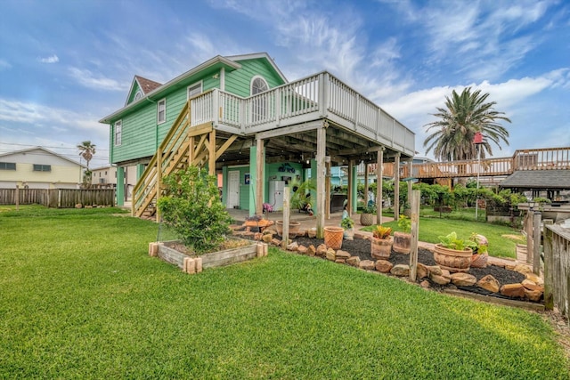 286 Ling St, Bayou Vista, TX 77563 - rear view of house featuring a deck, a garden, and stairs