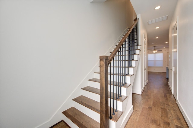 8964 Zurcher Ln, Houston, TX 77080 - stairs featuring wood finished floors, recessed lighting, baseboards, and ceiling fan