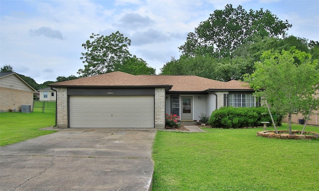 12662 Hackberry Dr, Willis, TX 77318 - single story home featuring concrete driveway, an attached garage, central AC, roof with shingles, and brick siding