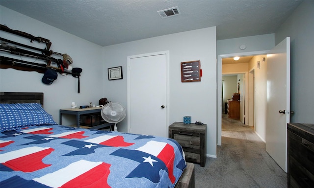 12662 Hackberry Dr, Willis, TX 77318 - carpeted bedroom featuring a textured ceiling