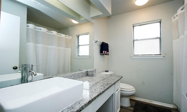 12662 Hackberry Dr, Willis, TX 77318 - full bath with toilet, baseboards, vanity, and a shower with curtain