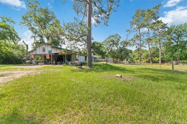12625 Huffmeister Rd, Cypress, TX 77429 - view of yard featuring an outdoor structure, a pole building, dirt driveway, and a carport