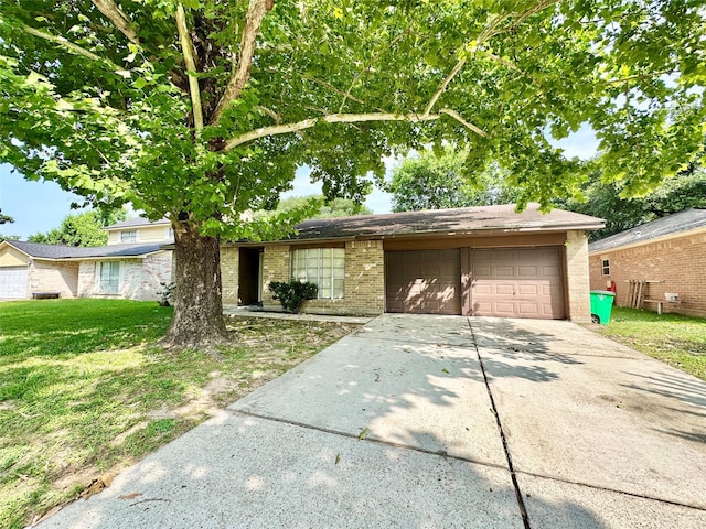 4515 Mossygate Dr, Spring, TX 77373 - view of front of house with an attached garage, brick siding, concrete driveway, and a front lawn
