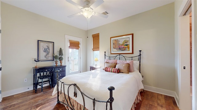 13830 Windlass Cir, Galveston, TX 77554 - bedroom with baseboards, wood finished floors, and a ceiling fan