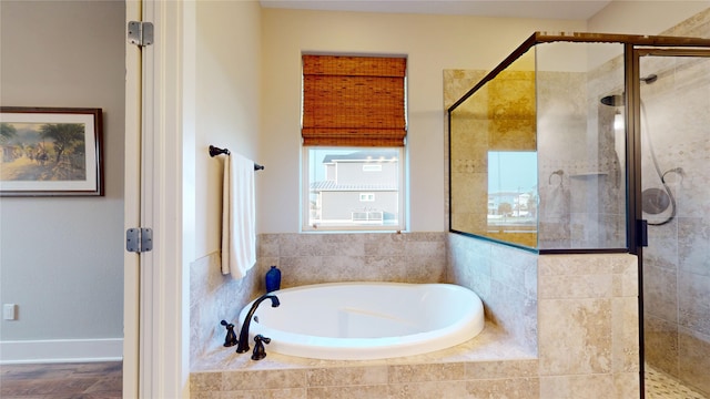 13830 Windlass Cir, Galveston, TX 77554 - full bath with a garden tub, a shower stall, and wood finished floors
