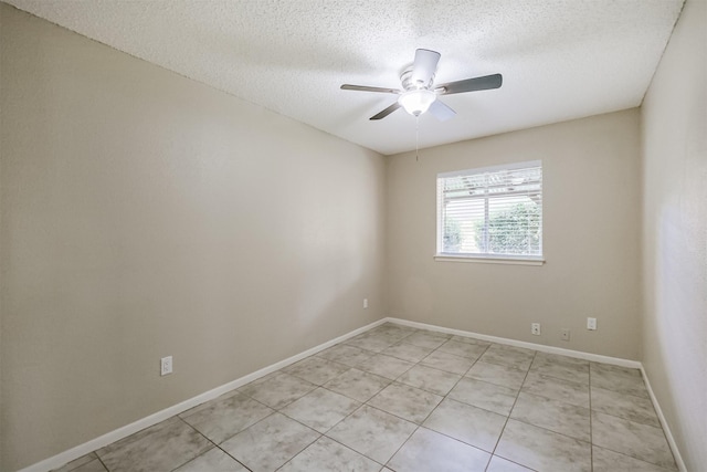 2738 Kettle Run, Sugar Land, TX 77479 - spare room with a textured ceiling, ceiling fan, light tile patterned floors, and baseboards