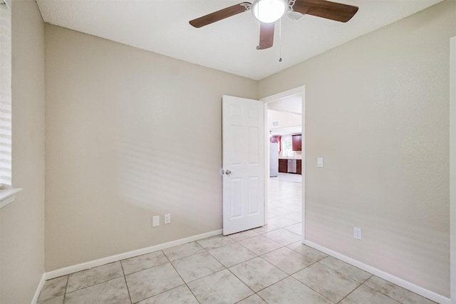 2738 Kettle Run, Sugar Land, TX 77479 - spare room with ceiling fan, light tile patterned floors, and baseboards