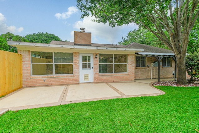 2738 Kettle Run, Sugar Land, TX 77479 - rear view of house with a chimney, a patio area, and brick siding