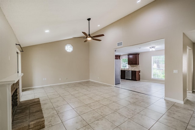 2738 Kettle Run, Sugar Land, TX 77479 - unfurnished living room featuring ceiling fan, light tile patterned flooring, a fireplace, recessed lighting, and high vaulted ceiling