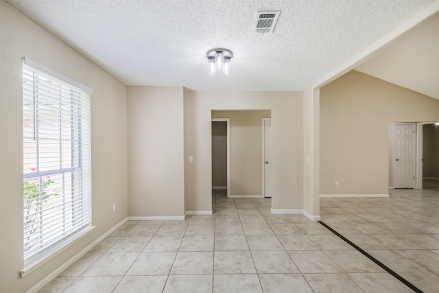 2738 Kettle Run, Sugar Land, TX 77479 - spare room featuring healthy amount of natural light, light tile patterned floors, and a textured ceiling