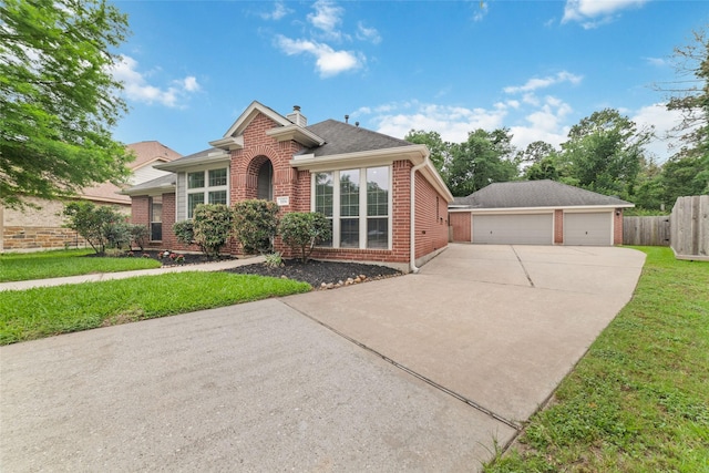 1706 Maddie Springs Ct, Spring, TX 77386 - view of front of house with brick siding, a detached garage, and a chimney