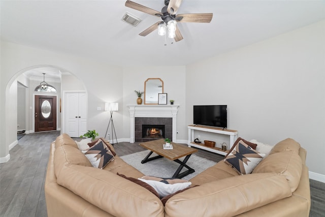 1706 Maddie Springs Ct, Spring, TX 77386 - living room featuring arched walkways, wood finished floors, ceiling fan, and baseboards