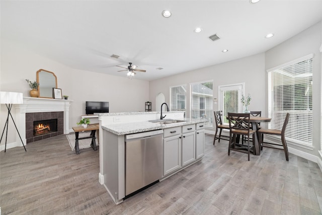 1706 Maddie Springs Ct, Spring, TX 77386 - kitchen with dishwasher, a sink, ceiling fan, open floor plan, and recessed lighting