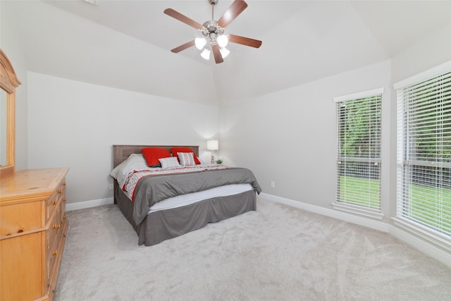1706 Maddie Springs Ct, Spring, TX 77386 - bedroom with lofted ceiling, multiple windows, light carpet, and baseboards